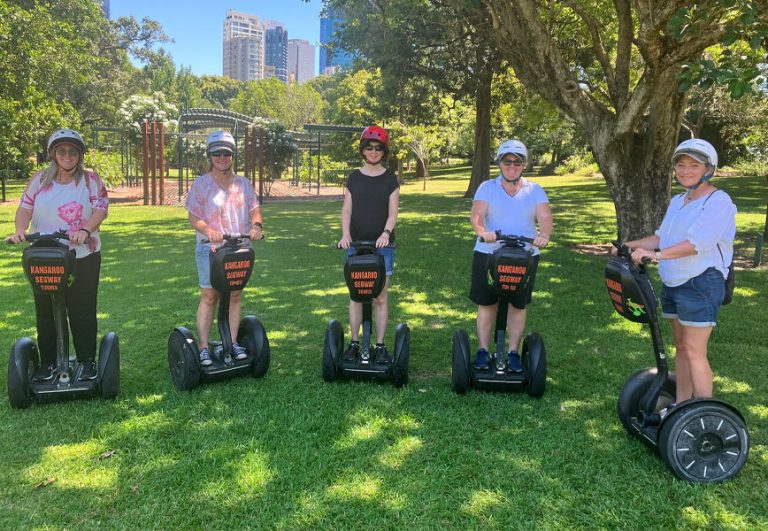 Segway tour riders on the Brisbane Riverwalk with Kangaroo Segway Tours